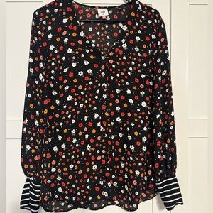 Black floral blouse with accent cuffs